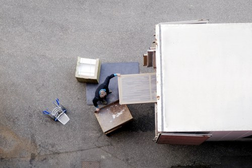 Removal crew unloading furniture into a new home in Dartford