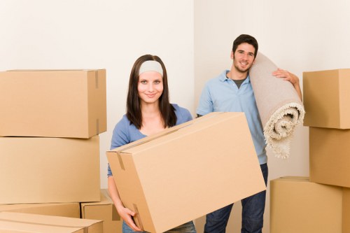 Packed moving boxes and furniture ready for transport