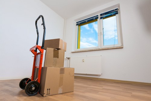 Mover wearing PPE while loading items into a van