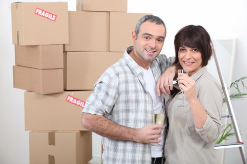 Local moving team assisting with boxes and household items